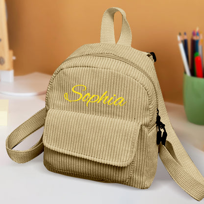 Interior view of mini corduroy backpack showing single roomy compartment – fits snacks and daily essentials for kids