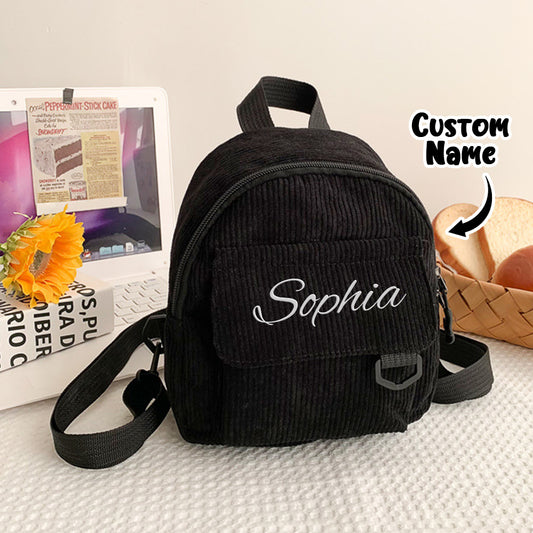 Front view of personalised mini corduroy backpack with embroidered name — compact kids' school bag for preschool