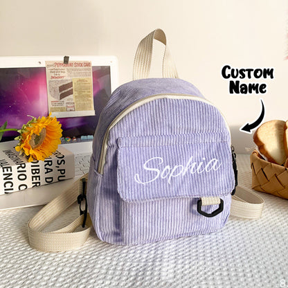 Selection of personalised mini corduroy backpacks displaying embroidered names and colour options — ideal personalised kids backpack gift