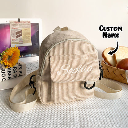 Mini school bag open to show roomy main compartment for snacks and small books — personalised embroidered name backpack