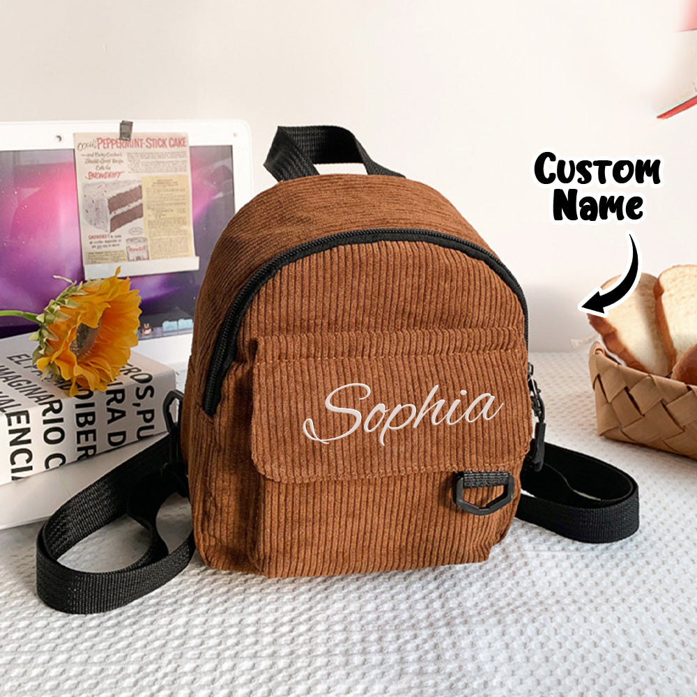 Side angle showing sturdy straps and quality stitching on the personalised kids backpack — durable corduroy finish