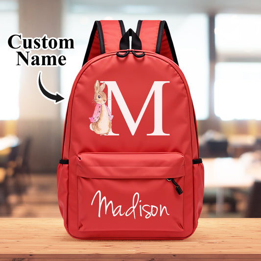Personalised rabbit initial backpack for kids – front view of compact Oxford fabric school bag with cute rabbit print, custom name and monogram, ideal personalised back-to-school gift (25×35×10cm)