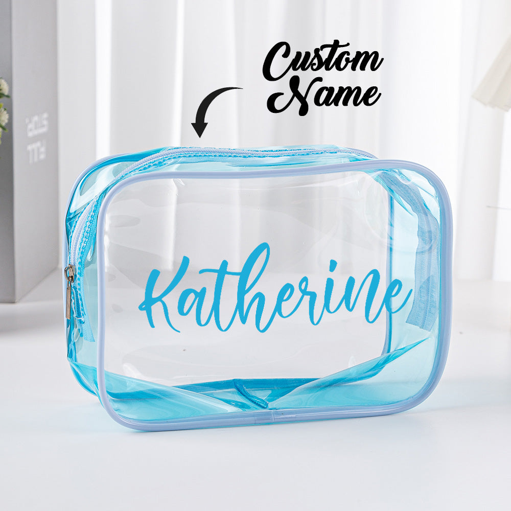 Open personalised clear cosmetic pouch showing brushes and toiletries – transparent waterproof PVC organiser for everyday use and travel