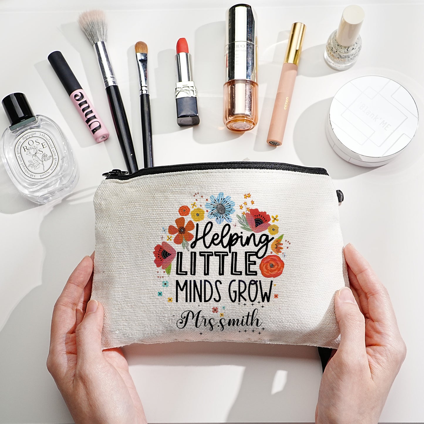 Textured canvas close-up of personalised bag showing vibrant floral print and crisp name customisation