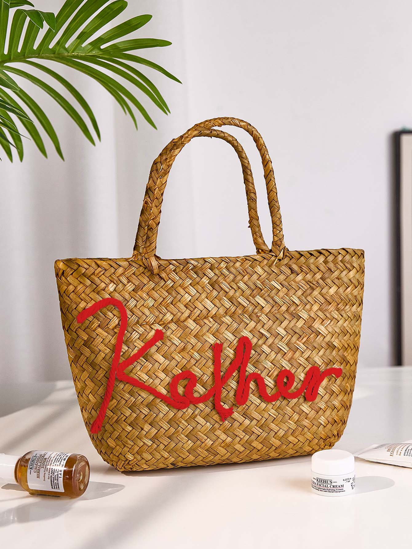 Close up detail of handcrafted straw weave and stitching on bohemian bucket bag highlighting handmade quality