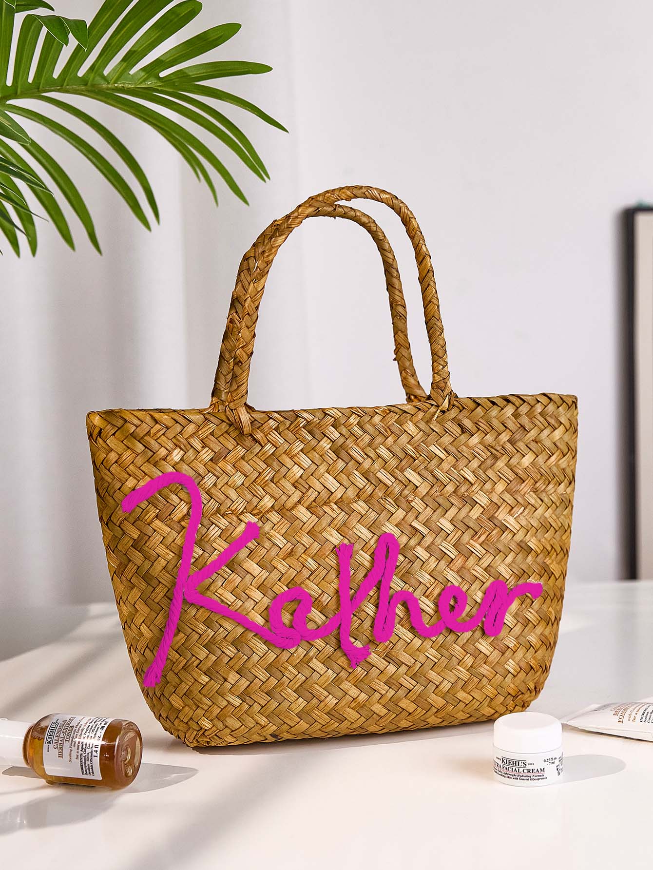 Interior pocket and lining detail of personalised straw bucket bag offering practical storage for travel and daily use