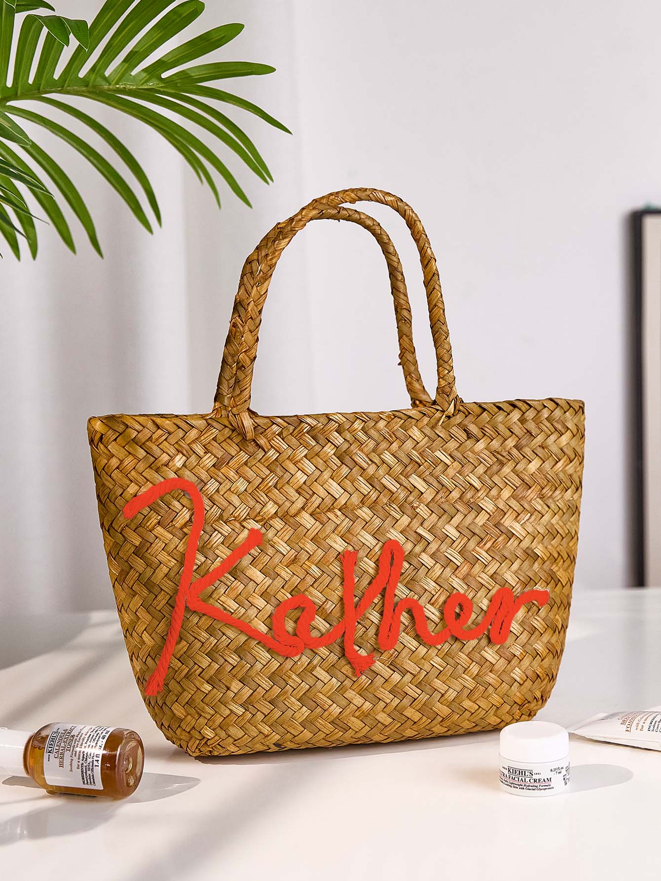 Side view showing shoulder strap and bucket silhouette of handmade bohemian straw bag, practical for travel and everyday use