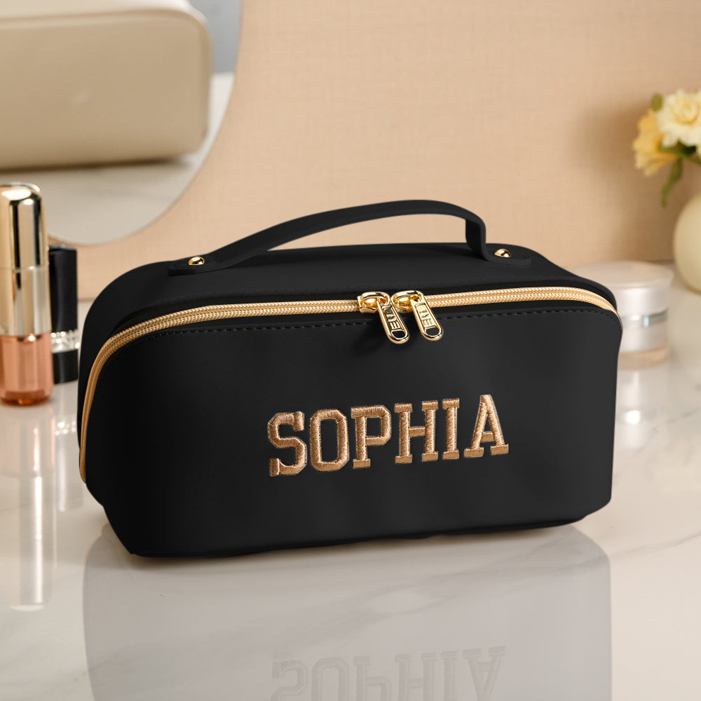 Travel scene with personalised waterproof makeup bag beside passport and luggage – ideal personalised travel gift for her