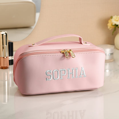 Personalised PU leather makeup bag in neutral beige showing elegant finish and embroidered name – perfect bridesmaid or birthday gift