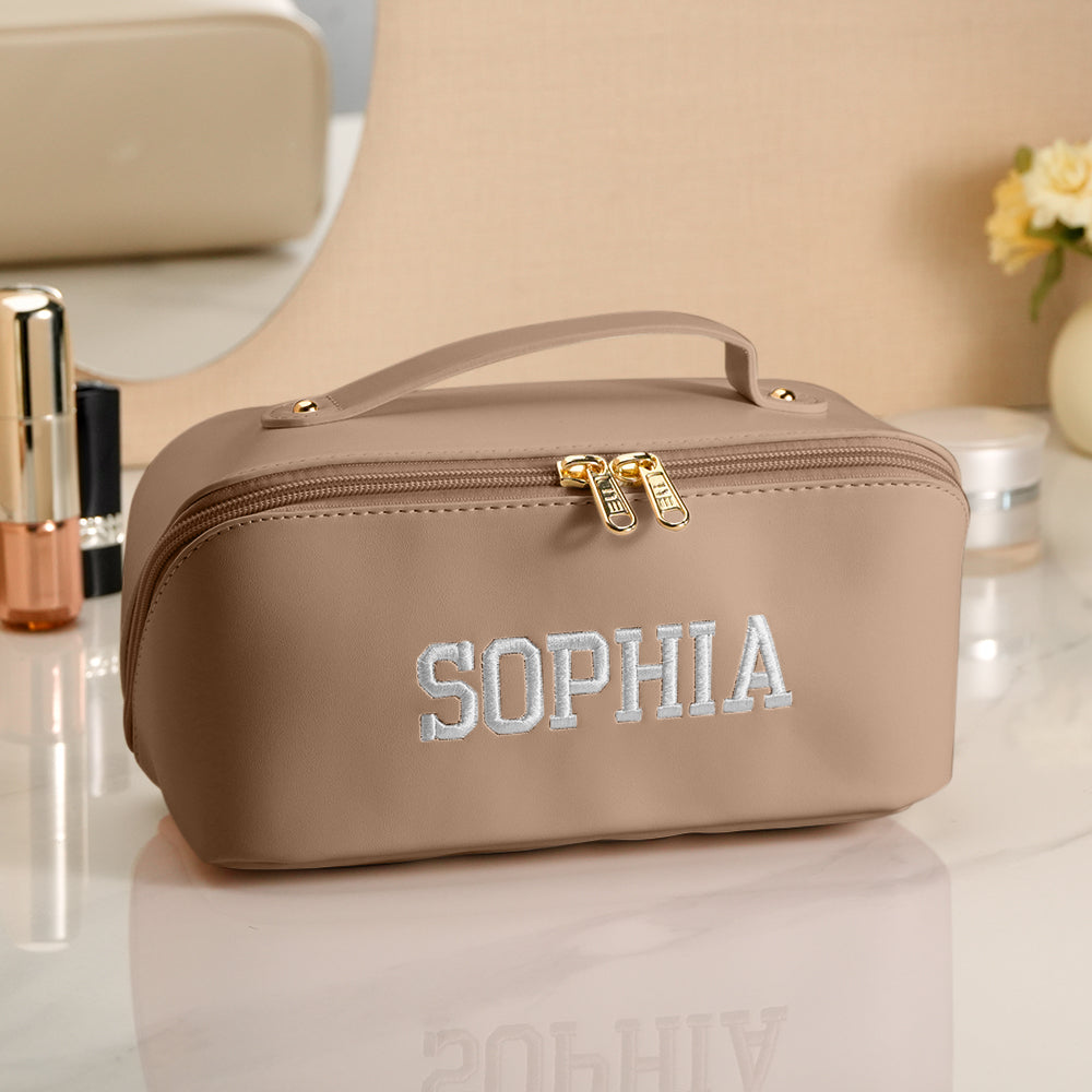 Interior view of personalised embroidered makeup bag showing organised compartments and easy-to-clean waterproof lining