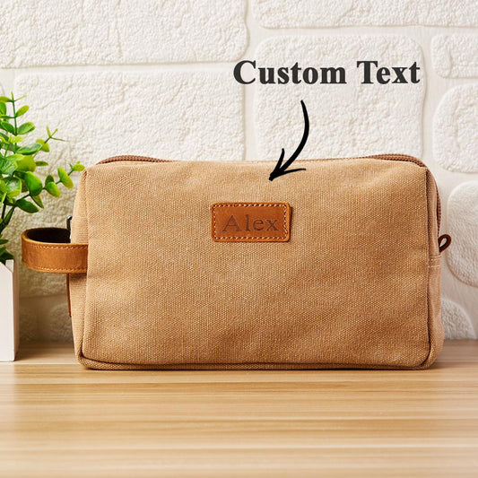 Personalised engraved canvas toiletry bag showing front monogram — elegant wedding gift and travel wash bag (25 x 14 x 11 cm)
