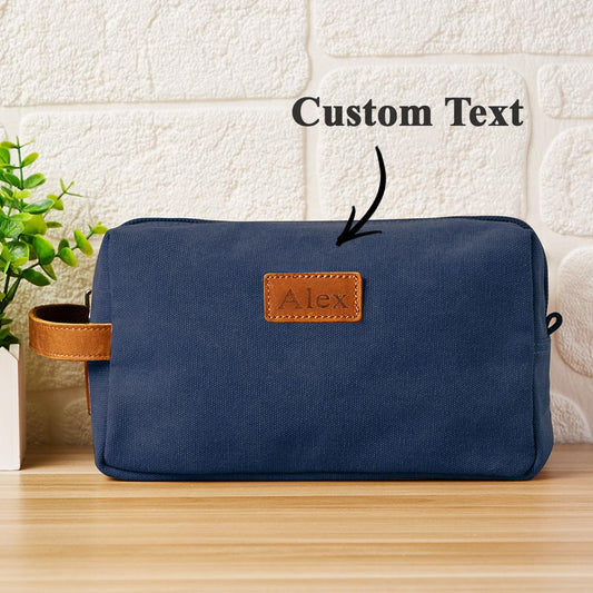 Personalised engraved canvas toiletry bag showing front monogram — elegant wedding gift and travel wash bag (25 x 14 x 11 cm)