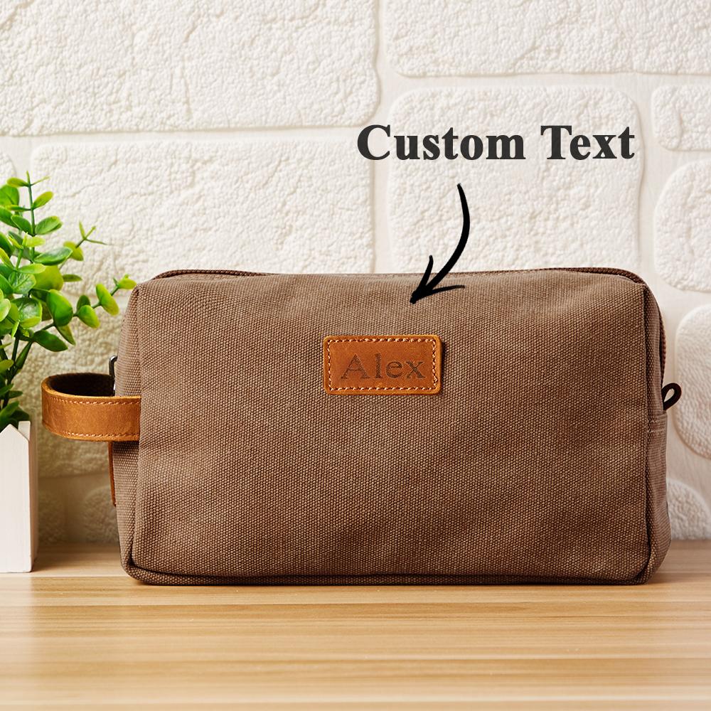 Close-up of engraved monogram detail on canvas toiletry bag — bespoke personalised gift for bridesmaids, groomsmen or newlyweds