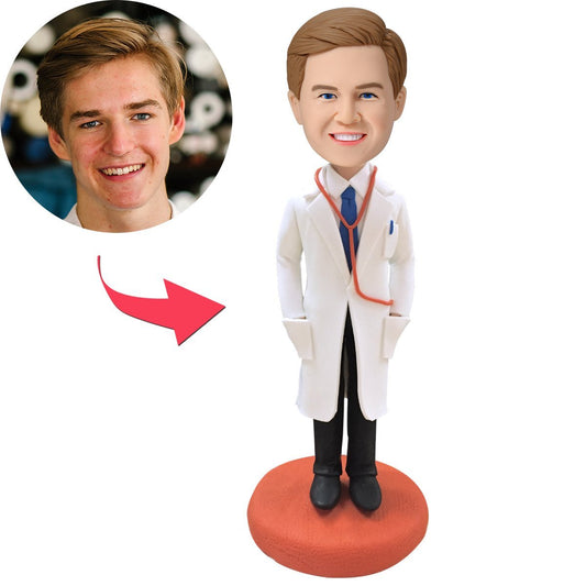 Custom Doctor Bobblehead with engraved lab coat — polymer clay personalised doctor figurine with customised head, stethoscope and engraved name on white lab coat, ideal medical staff gift