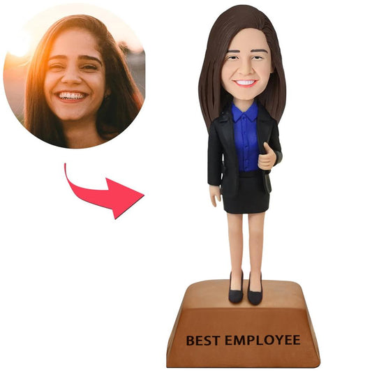 Angled view of personalised female executive bobblehead showing face sculpt detail and engraved trophy base, ideal promotion or congratulations gift