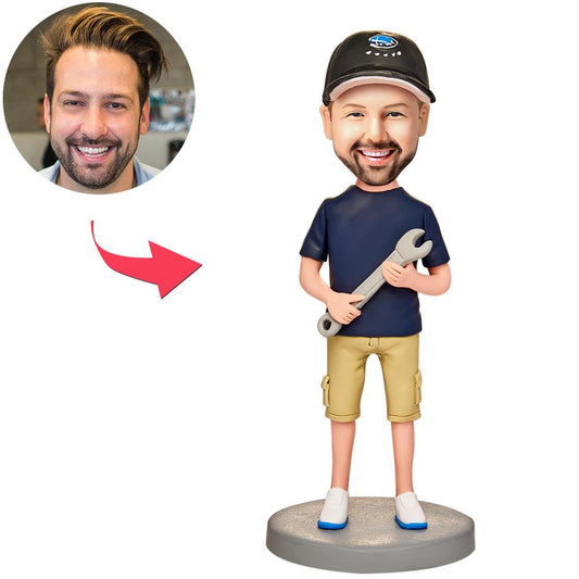 Personalised man bobblehead holding a spanner (wrench), handmade polymer clay with custom sculpted face and engraved base — perfect mechanic or tradie gift