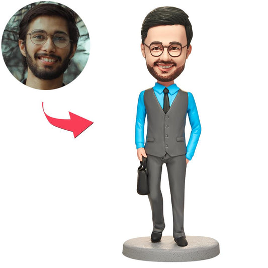 Personalised businessman bobblehead in suit holding briefcase, customised face with engraved text on base — polymer clay figurine, bespoke corporate gift for UK and Australia