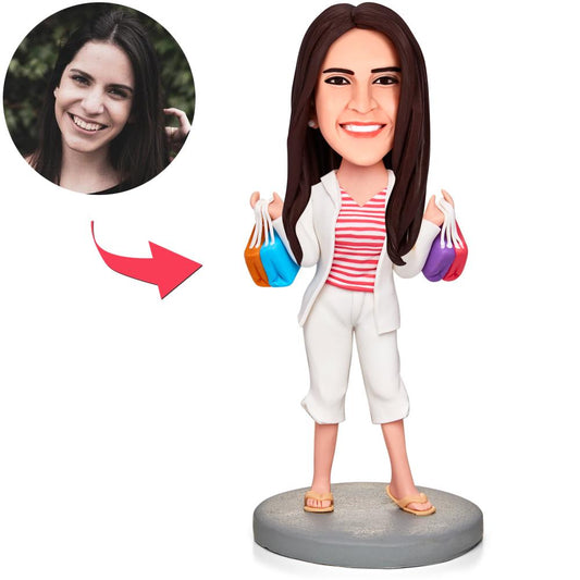 Front view of Happy Shopping Woman personalised bobblehead in polymer clay, smiling female figurine holding shopping bags with engraved text on the base — perfect personalised gift