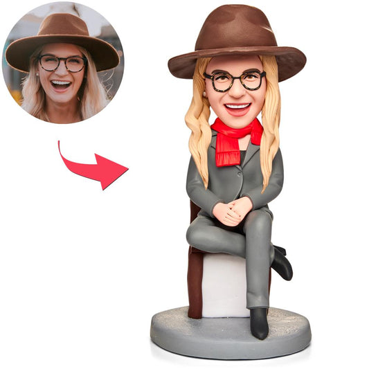 Custom female professor bobblehead UK — personalised face polymer clay figurine holding apple and book with engraved base, ideal teacher or graduation gift