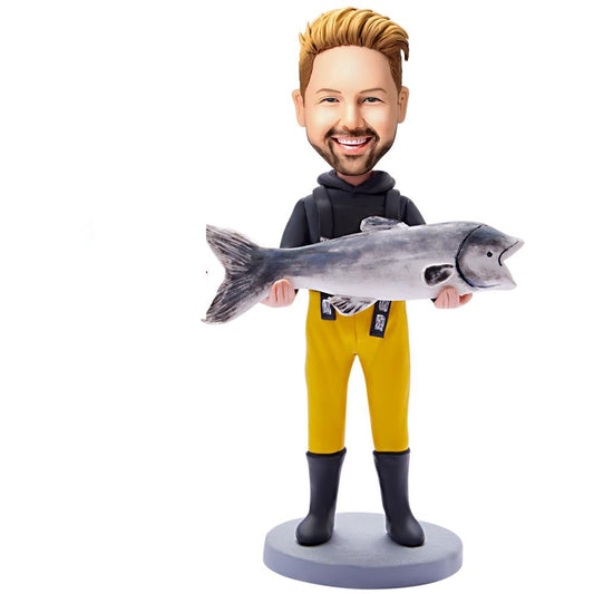 Personalised fishing bobblehead front view – polymer clay man holding fish, customisable head and engraved base with name or short quote, perfect angler gift