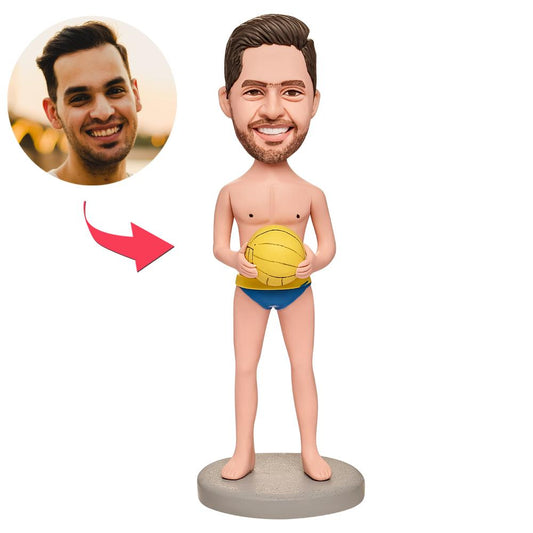 Personalised water polo boy bobblehead with custom head from a photo, hand‑finished polymer clay figurine in a sporty water polo pose with engraved base for name or date — ideal gift for players and fans