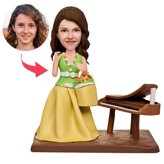 Close-up of personalised female pianist bobblehead showing detailed customised head sculpt, hairstyle and engraved name on piano – custom polymer clay keepsake