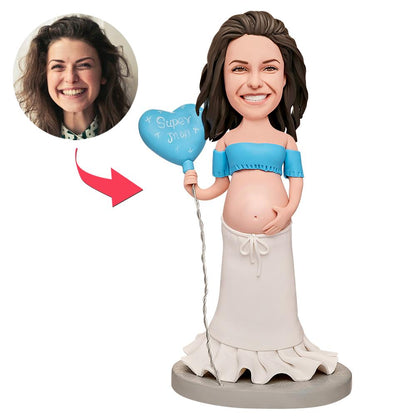 Close-up of Pregnant Super Mum holding a balloon personalised bobblehead showing engraved base and custom head detail; handcrafted polymer clay keepsake with engraved name or date option