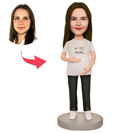 Personalised pregnant woman bobblehead in white T‑shirt — handcrafted polymer clay figurine with custom engraved text, personalised head matched to your photos, ideal pregnancy keepsake
