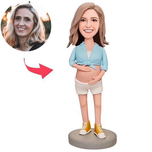 Handmade personalised pregnant woman bobblehead in blue outfit – custom polymer clay maternity keepsake with engraved name, ideal baby shower gift for expectant mum