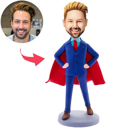 Front view of handmade personalised blue suit businessman bobblehead with engraved base, custom head from photos and polymer clay finish — ideal corporate desk ornament