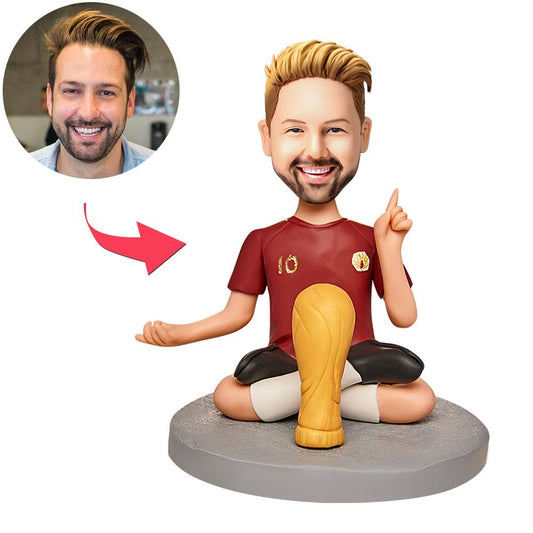 Personalised World Cup bobblehead with custom head and engraved text on the base — polymer clay football figure in team kit, perfect football gift