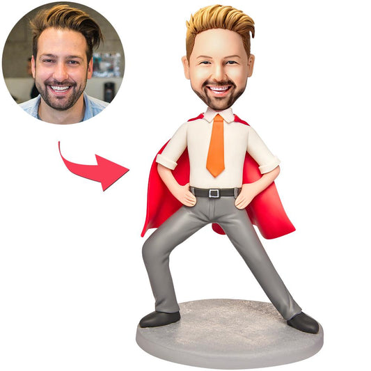 Personalised red cape suit bobblehead for men with custom face and engraved text on base, hand-sculpted polymer clay desk ornament — ideal gift for husband, dad or colleague