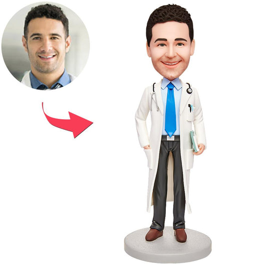 Front-facing handmade polymer clay male anaesthetist (anaesthesiologist) custom bobblehead in scrubs with personalised engraved base — doctor desk ornament and thank‑you gift for UK & Australia