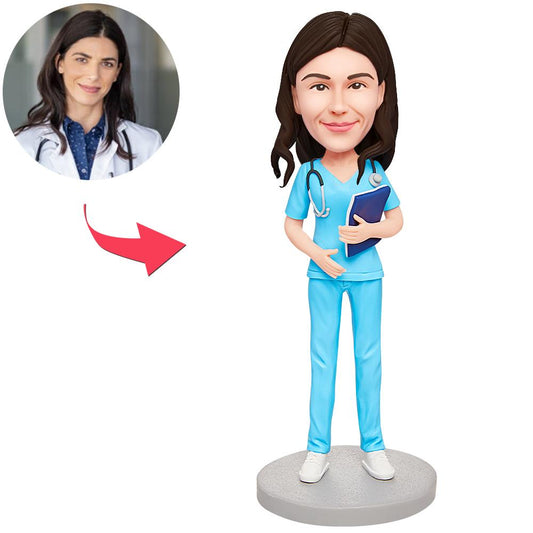 Personalised female obstetrician and gynaecologist bobblehead with custom head likeness and engraved base – polymer clay doctor gift