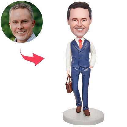 Front view of custom men's bobblehead in a business suit holding a briefcase — personalised head sculpt with engraved text on the base, handcrafted polymer clay desk gift ideal for corporate, boss or retirement (UK & Australia)