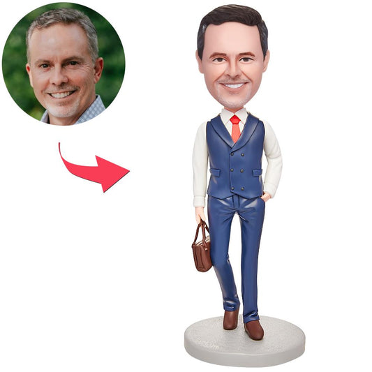 Front view of custom men's bobblehead in a business suit holding a briefcase — personalised head sculpt with engraved text on the base, handcrafted polymer clay desk gift ideal for corporate, boss or retirement (UK & Australia)