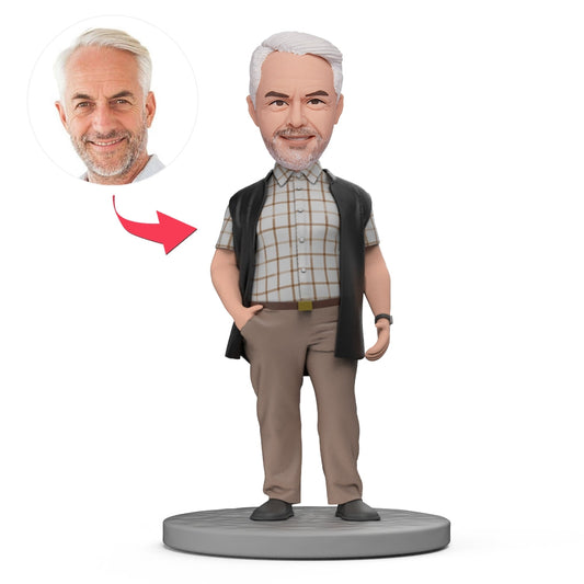 Personalised men's bobblehead in white top and black vest – polymer-clay figurine with customised head, realistic facial detail and engraved text on the base