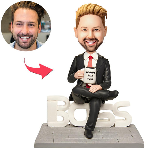 Personalised polymer clay bobblehead of a domineering male boss with customised head likeness and engraved base reading Best Boss Ever — a humorous personalised desk keepsake and gift for him