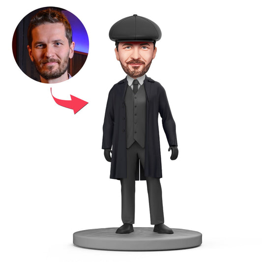 Black Trench Coat Shelby personalised bobblehead — handcrafted polymer clay custom head mini figure in a black trench coat, personalised face sculpted from your photo, choice of bobble or stationary head and engraved base for name or date, ideal personalised face gift