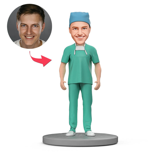 Personalised anaesthetist bobblehead in blue scrubs with hand‑sculpted face and engraved base – custom polymer clay doctor bobble head gift for NHS and Australia