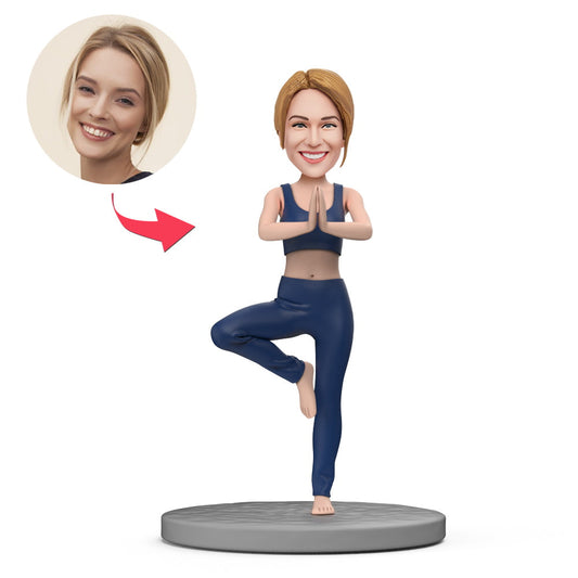 Handcrafted personalised yoga teacher bobblehead in a standing yoga pose, polymer clay figurine with a customised head from your photo and engraved base — perfect personalised teacher gift