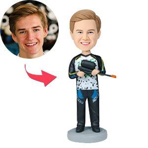 Front view of personalised paintball player bobblehead in polymer clay with engraved text on the base — custom paintball figurine and personalised gift