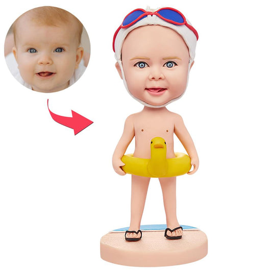 Personalised child bobblehead with swim ring, hand-painted polymer clay figurine with short hairstyle and engraved name, playful kids gift