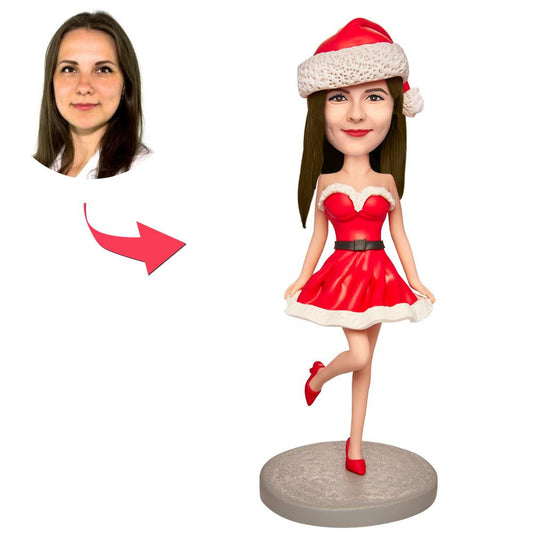 Handcrafted polymer clay personalised Christmas bobblehead of a happy girl in a red outfit with engraved text on the base — custom bobblehead, personalised face gift for her or grandma