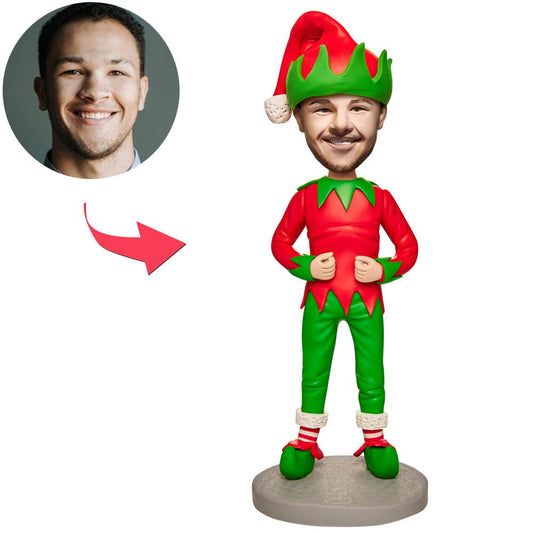Personalised Christmas Elf Bobblehead — hand-finished polymer clay figure with custom head likeness and engraved base, festive red and green costume; ideal personalised ornament and custom bobblehead gift