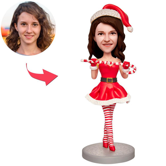 Personalised Christmas Girl bobblehead holding candy bars — polymer clay figure with engraved name, customisable head