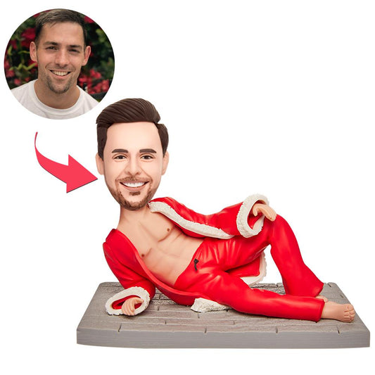 Personalised lying Christmas boy bobblehead ornament in polymer clay with engraved base — custom head from your photo, perfect personalised engraved Christmas gift