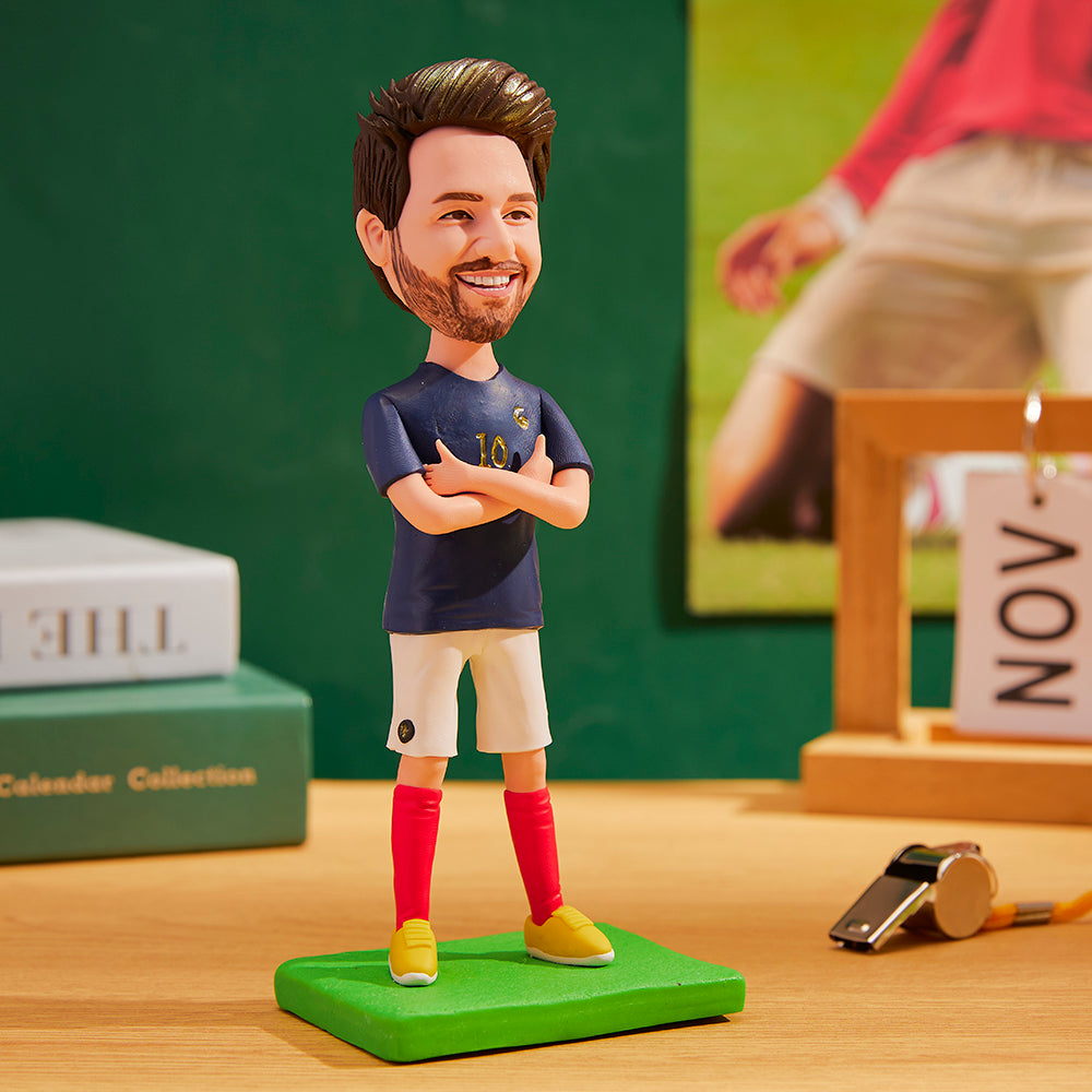 Front view World Cup France personalised bobblehead in blue France kit with engraved text on the base — hand-crafted polymer clay with a customised head matching your photo, ideal football fan gift