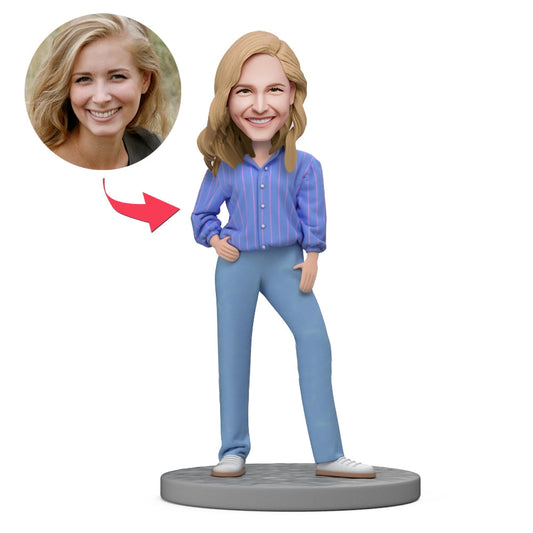 Personalised polymer clay bobblehead wearing a blue striped shirt on a wooden base, engraved bobblehead with custom text — unique personalised gift