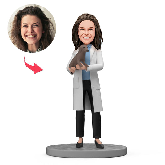Personalised female vet bobblehead holding a pet — custom polymer‑clay veterinarian figurine with customised head and optional engraved text